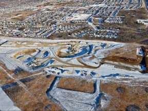 Aerial view of West Springs gravel pit and adjacent neighbourhoods. Photo courtesty of Alberta government