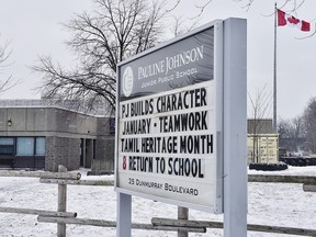 A sign outside of Pauline Johnson Junior Public School is seen in Toronto on Monday, Jan. 15, 2018. Toronto police have concluded that an incident reported by an 11-year-old girl who claimed her hijab was cut by a scissors-wielding man as she walked to school did not happen.