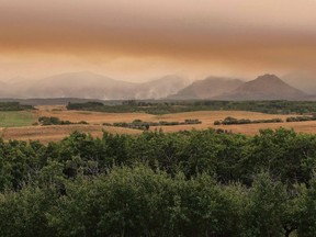 A large wild fire continues to burn in Waterton Lakes National Park, Alberta, on Tuesday, September 12, 2017. A Parks Canada official says a powerful wildfire that shut down Waterton Lakes National Park late last summer will inevitably change the species of birds in the area.