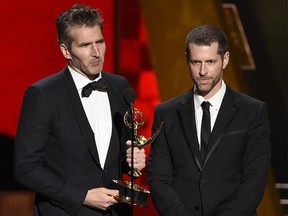 FILE - In this Sept. 20, 2015 file photo, creator-showrunners David Benioff, left, and D.B. Weiss accept the award for outstanding writing for a drama series for "Game Of Thrones" at the 67th Primetime Emmy Awards in Los Angeles. (Photo by Chris Pizzello/Invision/AP, File) ORG XMIT: NYET501