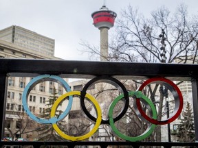 The Calgary Tower is seen with Olympic rings built into railing at Olympic Plaza in downtown Calgary.