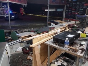 Papa Baldy’s Pizza in Red Deer's Westview Shopping Plaza posted this picture of the front of the restaurant after a pickup truck smashed into it.