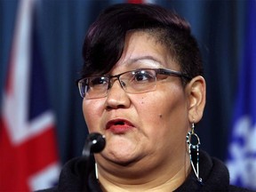 Colleen Cardinal, network coordinator of the National Indigenous Survivors of Child Welfare Network, speaks during a news conference in Ottawa, Friday February 2, 2018. A group of '60s Scoop survivors wants to make sure fellow survivors properly understand the federal government's proposed settlement ??? and ultimately reject it. THE CANADIAN PRESS/Fred Chartrand ORG XMIT: CPT116