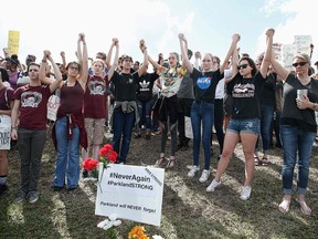 Students of area High Schools rally at Marjory Stoneman Douglas High School after participating in a county wide school walk out in Parkland, Florida on February 21, 2018.  A former student, Nikolas Cruz, opened fire at Marjory Stoneman Douglas High School leaving 17 people dead and 15 injured on February 14. / AFP PHOTO / RHONA WISERHONA WISE/AFP/Getty Images