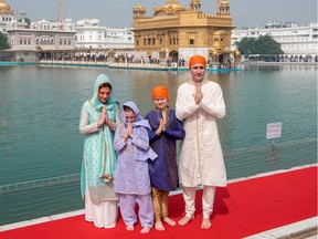 Prime Minister Justin Trudeau and his wife, Sophie Gregoire Trudeau,  along with their children, pay their respects at the Sikh Golden Temple in Amritsar, India.