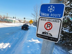 A sign designating a snow route.