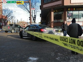 Police closed down Centre Street at 3rd street S.E. in downtown Calgary on Tuesday morning February 13, 2018 after a serious collision between an SUV and a pedestrian. Gavin Young/Postmedia