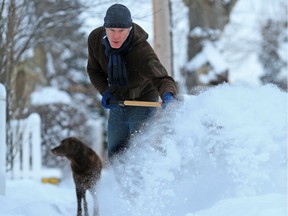 Chris Edison clears snow from a sidewalk in Crescent Heights. Not everyone is as diligent as Edison, writes Naomi Lakritz.