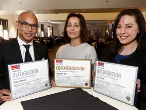 Award recipients L-R, Shaun Marcia, Margaret Bell and Kim Fisher with their certificates during the Beyond the Call, Calgary Fire Department Recognition Awards Luncheon at Fort Calgary. The awards recognize exceptional acts by citizens and emergency service personnal, both on and off-duty on Wednesday February 21, 2018. Darren Makowichuk/Postmedia