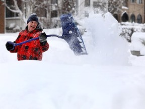 Rene Roy was busy digging out as the city received a massive dump of snow overnight on Thursday February 8, 2018.