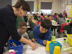 Students tackle an assignment in a Grade 4 classroom in Edmonton.