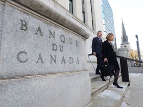 Bank of Canada Governor Stephen Poloz and Carolyn Wilkins, Senior Deputy Governor, walk to the National Press Gallery in Ottawa on Wednesday, October 25, 2017. Canada's competition regulator says it's not the size of the data, it's the size of the deception that it must guard against as it considers protecting innovation and competition in a marketplace where big data is seen as a growing concern.