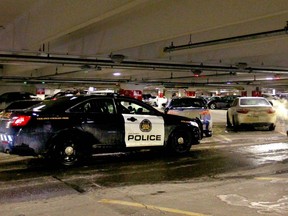 Calgary Police Service stands at the ready as police prepare to swoop in on an alleged stolen car in the west parkade at Chinook Centre in southwest Calgary on Saturday, February 10, 2018. The bad guy managed to slip out of the parkade and was lost despite marked units and the K9 units watching over the car. Jim Wells/Postmedia