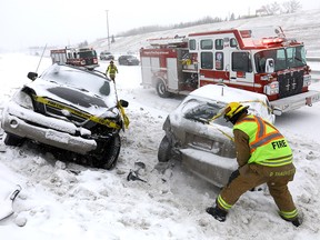 Calgary Police, Fire and EMS contend with multiple accidents along Deerfoot Trail from heavy snow on Saturday February 3, 2018.