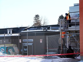 Workers and Investigators inspect Fairview Arena in Calgary after the roof caved in on Tuesday on Wednesday February 21, 2018. Darren Makowichuk/Postmedia