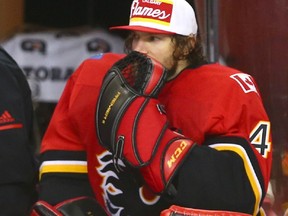 Flames goalie Mike Smith sits on the bench after being pulled in the third period during game action between the Tampa Bay Lightning and Calgary Flames in Calgary on Thursday. Photo by Jim Wells/Postmedia.