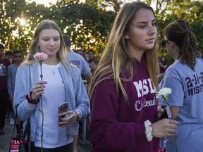 Students were greeted by supporters, signs and flowers as they returned to class at Marjory Stoneman Douglas High School on Feb. 28, 2018.