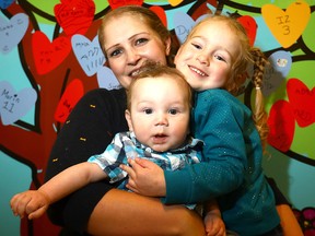 Kalie Reimer with daughter, Molly, 3, and son, Hank, who has recovered from a massive blood clot in his brain.