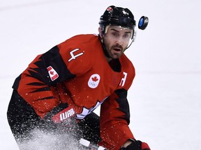 Canadian defenceman Chris Lee tracks the puck against South Korea on Feb. 18.