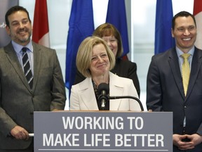 Premier Rachel Notley, along with members of government and industry, answers questions about the Alberta government's up to $1 billion investment in the partial upgrading of oil sands bitumen during a news conference at the Federal Building in Edmonton on Monday, Feb. 26, 2018.