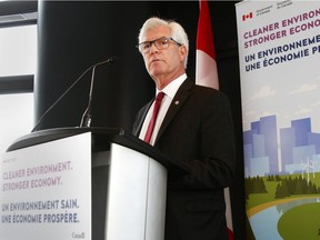 Natural Resources Minister Jim Carr announces a new project assessment process during a press conference held at the Bow Tower in downtown Calgary on Thursday, February 8, 2018.