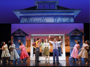 Kenneth Mosley as Berry Gordy (centre right) and the cast of Motown the Musical. Courtesy, Joan Marcus / Broadway Across Canada