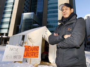 Garret Smith and other Indigenous men set up a tent across from the downtown Calgary courthouse on Sunday protesting the acquittal of Raymond Cormier in the death of 15-year-old Tina Fontaine.