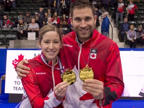 Kaitlyn Lawes and John Morris hold their medals after an 8-6 victory over Val Sweeting and Brad Gushue in the Olympic Trials final at Stride Place in Portage La Prairie, Man., Sunday Jan.7, 2018. Lawes and Morris will represent Canada when mixed doubles curling makes its Olympic debut at the Pyeongchang Games.