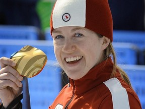 Lauren Woolstencroft of Canada, shows off her 4th gold medal from a Super G. race  at the 2010 Paralympic Games March 19,  2010 in Whistler B.C. Mark van Manen/PNGNews Service