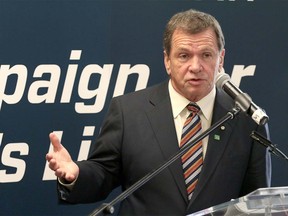 TD Bank deputy chair Frank McKenna speaks at the presentation of $1million to the Calgary Public Library from TD Bank at the Central Library in Calgary, Ab., on Friday April 17, 2015. Mike Drew/Calgary Sun/Postmedia Network