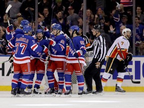 The New York Rangers celebrate after a goal by Kevin Hayes (No. 13)  of the New York Rangers in the first period against the Calgary Flames during their game at Madison Square Garden on February 9, 2018 in New York City.