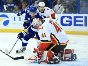 Flames goaltender Mike Smith stones Ondrej Palat  of the Tampa Bay Lightning on Jan. 11, 2018 in Tampa, Fla.