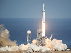 The SpaceX Falcon Heavy rocket lifts off from Kennedy Space Center on Feb. 6, 2018 in Cape Canaveral, Florida. The Falcon Heavy is the most powerful rocket in the world and is carrying a Tesla Roadster into orbit.