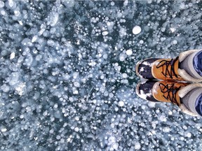 Ice bubbles trapped in Abraham Lake. Courtesy, Caitlyn Giorgio and Travel Alberta