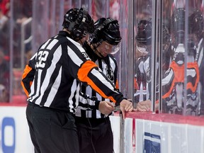 Referees Tom Kowal, left, and Dennis LaRue and all the other on-ice officials will no longer make goaltender interference calls if the league can get its new initiative approved by the players and owners.