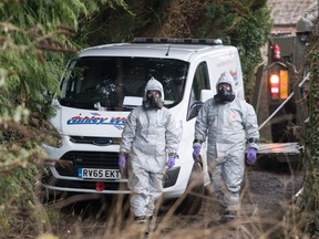 Investigators in protective clothing remove a van from an address in Winterslow near Salisbury, as police and members of the armed forces continue to investigate the suspected nerve agent attack on Russian double agent Sergei Skripa on March 12, 2018 in Wiltshire, England.