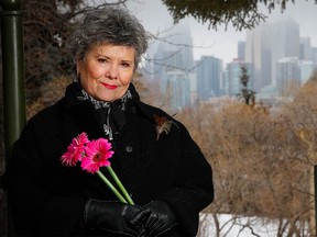 Sharon Stevens poses for a photo outside the Reader Rock Garden in Calgary, which has just been designated a national historical site. Al Charest/Postmedia