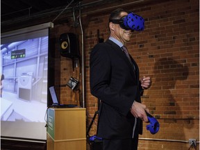 Finance Minister Joe Ceci tries out virtual reality ahead of Thursday's provincial budget.