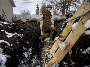 High school student Dylan Ferris pictured in the trench he built in his backyard, in Edmonton Alta, on Thursday March 29, 2018. Ferris is spending 24 hours in a muddy trench in his parent's yard, all for a social studies project.