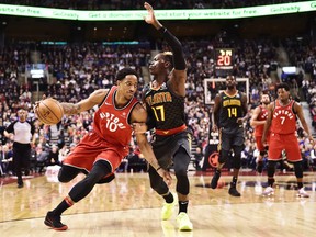 Toronto Raptors guard DeMar DeRozan (left) drives past Atlanta Hawks guard Dennis Schroder on March 6.