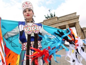 Calgary Stampede 2018 Indian Princess Cieran Starlight dances at Berlin's Brandenburg Gate as the group visits Germany to participate in the Internationale Tourismus-Boerse Berlin (ITB) tourism trade fair on March 9, 2018. Adam Berry/Getty Images