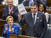 Ontario Finance Minister Charles Sousa delivers the provincial budget while Premier Kathleen Wynne applauds, Wednesday March 28, 2018.