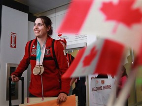Canadian para alpine Olympian Alana Ramsay from Calgary smiles as she is welcomed home at the Calgary International Airport on Monday March 19, 2018. Ramsay was a double bronze medallist at the 2018 Paralympics.