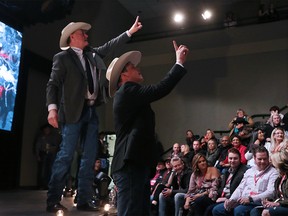 Auctioneers takes bids during the GMC Rangeland Derby tarp auction at Stampede Park on Thursday March 22, 2018.  Gavin Young/Postmedia