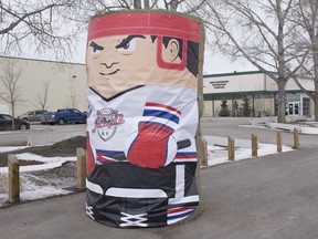 A big Kraft Hockeyville poster tied to hay-bales stands in front of the Bob Snodgrass Recreation Complex in High River on Thursday, March 29, 2018.