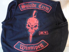 A motorcycle gang vest is shown in this RCMP handout image. An alleged full-patch member of an outlaw motorcycle gang is in custody after the RCMP says one of its officers was almost hit by a passing motorist during a traffic stop near Winnipeg.