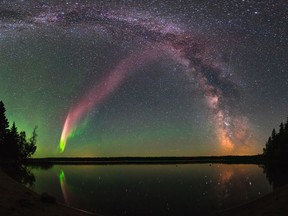 The celestial phenomenom known as "Steve" and the Milky Way are shown in the sky over Childs Lake, Manitoba in a handout photo.