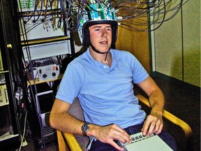 Kyle Mathewson, a neuroscientist at the University of Alberta is shown with the university's Imagent brain-imaging equipment.