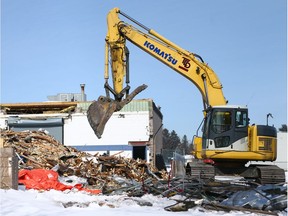 Crews work a the Fairview Arena site in Calgary on  Friday, March 16, 2018. Investigators are doing selective forensic demolition to determine the cause of the the roof collapse on February 20. Jim Wells/Postmedia