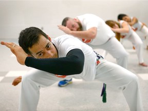 Frank Fowler leads a Capoeira class in southwest Calgary March 20, 2018. Capoeira classes combine Brazilian martial arts and dance into a fitness class. Jim Wells/Postmedia